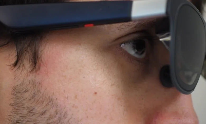 Close-up of person wearing augmented reality glasses.
