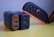 Close-up of USB-C chargers and Nintendo Switch controller on yellow surface.