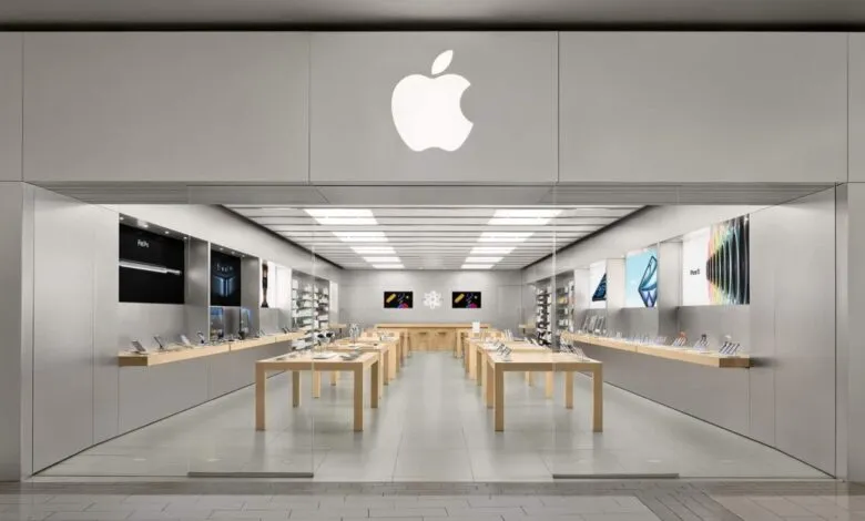 Apple Store interior with display tables and product showcases.