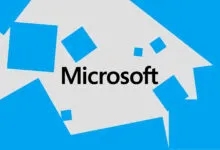 Microsoft logo with blue squares on a light gray background.