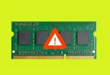 RAM module with a warning sign, indicating a potential problem.