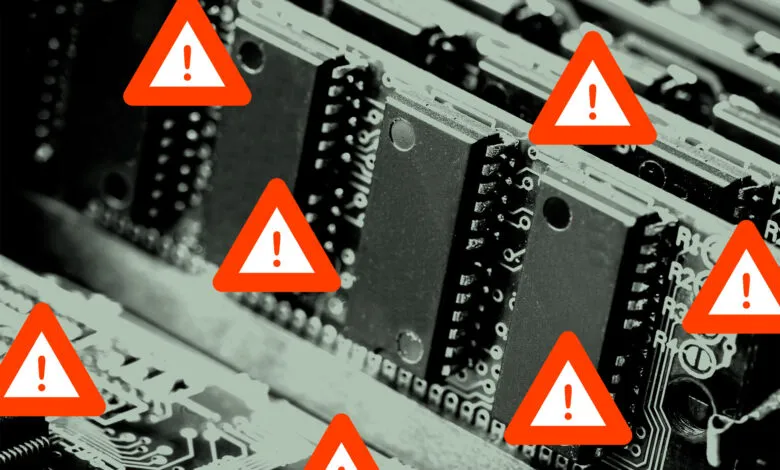 Close-up of computer RAM with warning signs indicating potential issues.