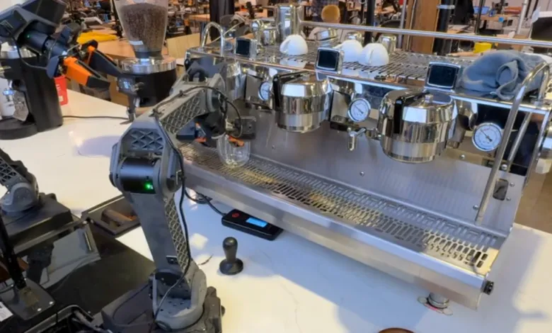 Robotic arm making espresso with a professional machine.