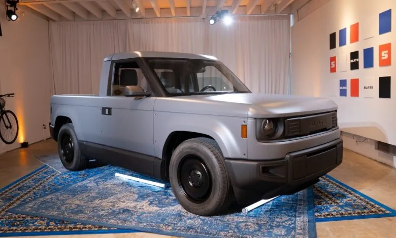 Gray Slate truck on blue rug, minimalist design, well-lit studio.