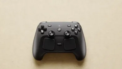 Black Steam Controller on a beige surface, top-down view.