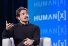 Guillermo Rauch speaks at Human[X] conference, gesturing with his hand.