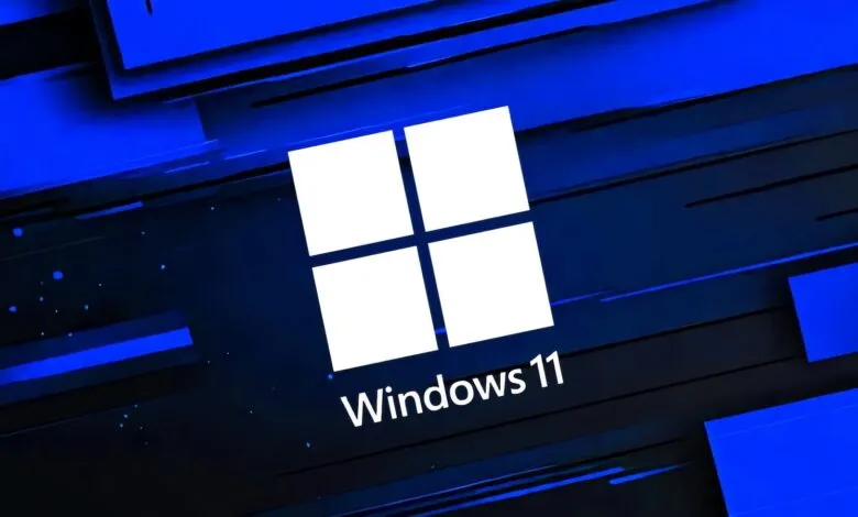 Windows 11 logo on a blue and black abstract background.