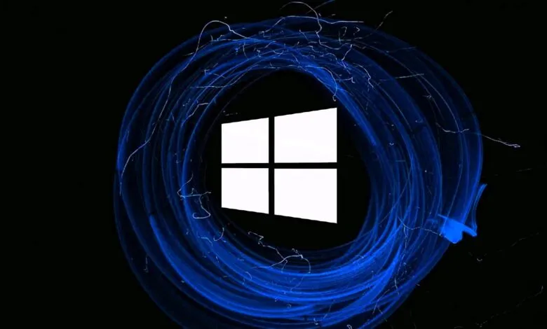 Windows logo surrounded by swirling blue light trails on a black background.