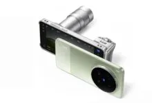 Vivo X100 Ultra smartphone with camera lens attachment.