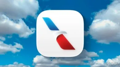 American Airlines app icon against a blue sky with fluffy white clouds.