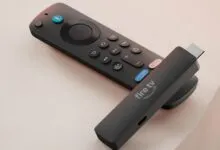Amazon Fire TV Stick and remote on a light surface.