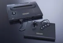 Neo Geo console and joystick on a reflective surface.