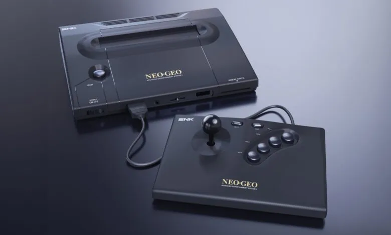 Neo Geo console and joystick on a reflective surface.