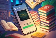 Phone displays Spotify audiobook 'Inege's enieduns' surrounded by stacked books.