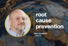 Alec Summers of MITRE presents on root cause prevention with digital globe background.