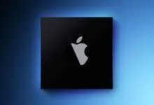 Apple silicon chip with Apple logo on a blue gradient background.