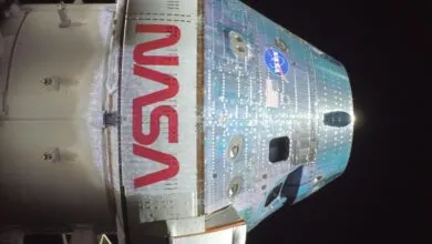 Close-up of the Orion spacecraft with NASA logo and American flag.