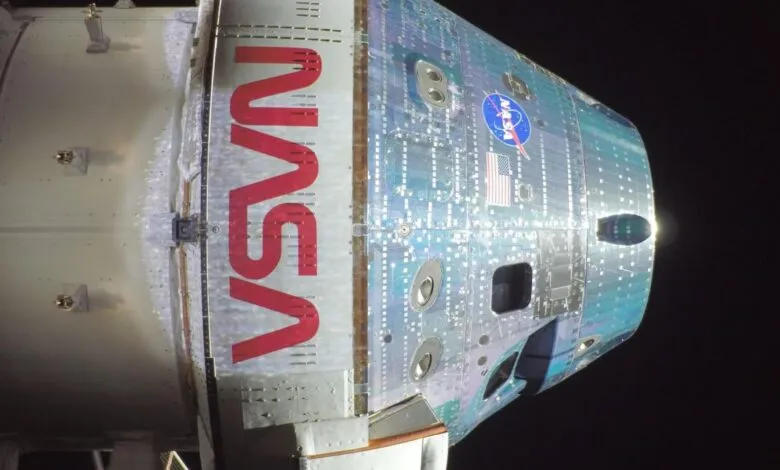 Close-up of the Orion spacecraft with NASA logo and American flag.