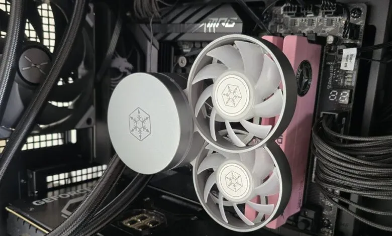 Inside a computer case showing cooling system with fans and components.