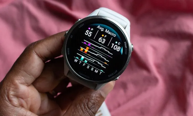 Close-up of a Garmin watch displaying average macro data.