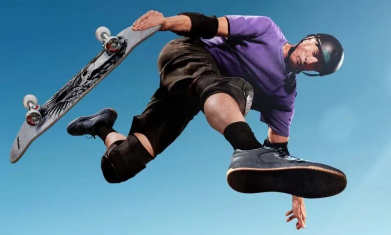 Skateboarder in mid-air performing trick against a clear blue sky.