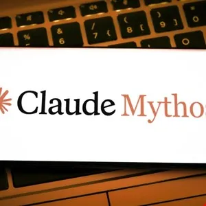 Claude Mythos logo displayed on a screen with a keyboard in the background.