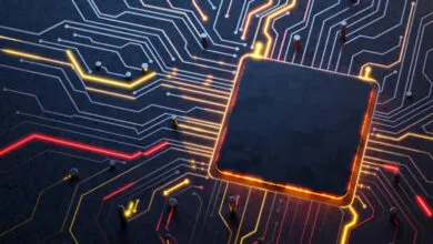 Close-up of a computer chip with glowing circuits and a dark central processor.