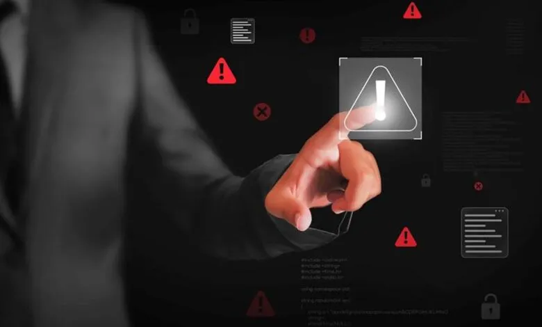 Hand touches digital screen with warning signs, locks, and code snippets.