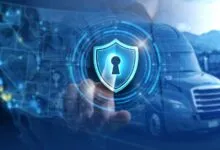 Semi-truck with digital shield overlay for cybersecurity concept.