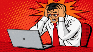 Cartoon man in distress at laptop, hands on head.