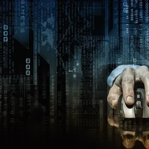 Hand using a computer mouse with digital code overlay, representing technology.