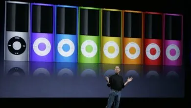 Steve Jobs presents colorful iPod Nanos on stage at Apple event.