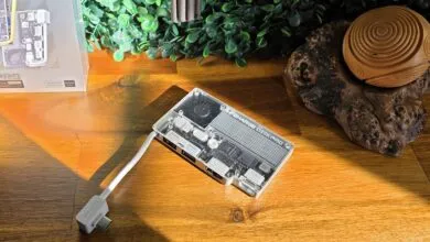 Sharge Disk Pro portable SSD with hub, clear case showing internal components.