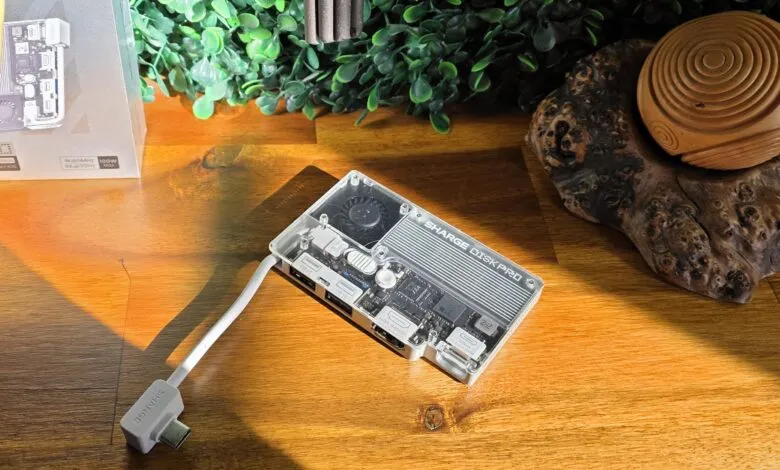 Sharge Disk Pro portable SSD with hub, clear case showing internal components.