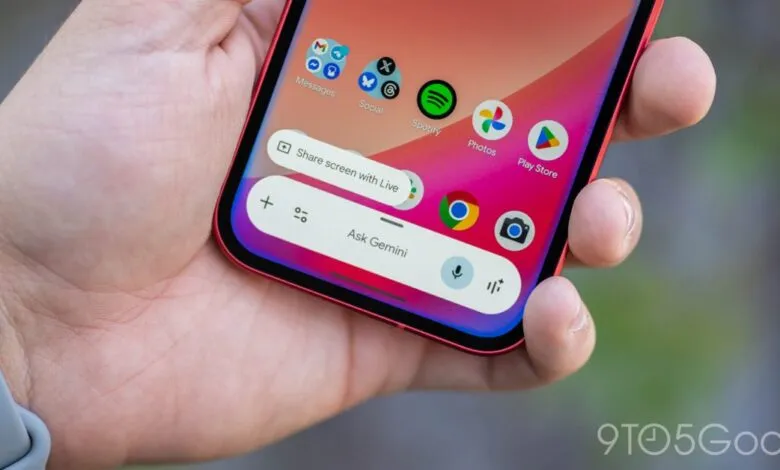 Hand holding a phone displaying the 'Ask Gemini' prompt and app icons.