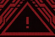 Red pixelated warning sign with exclamation point on black background.