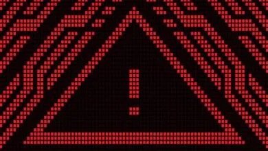 Red pixelated warning sign with exclamation point on black background.