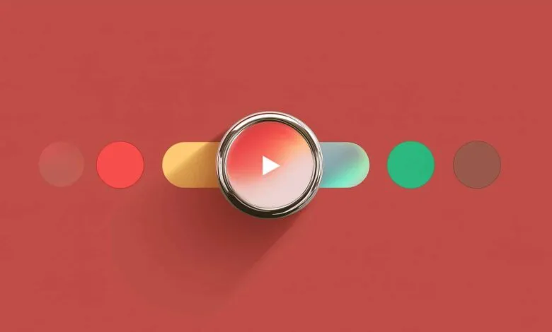 Abstract play button with colorful shapes on a red background.