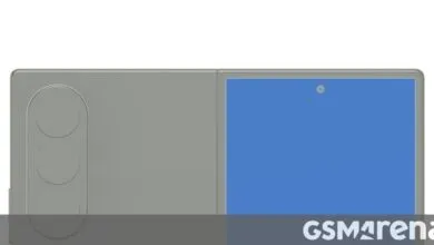 Foldable smartphone with triple camera system and blue screen.