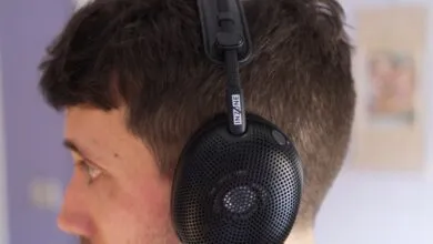 Close-up of black Inzone headphones on a person's head.