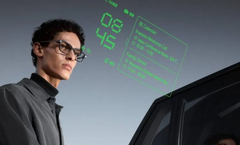 Man wearing smart glasses displaying calendar and time information.