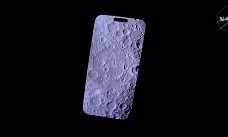 iPhone screen displays detailed lunar surface with craters, NASA logo in corner.