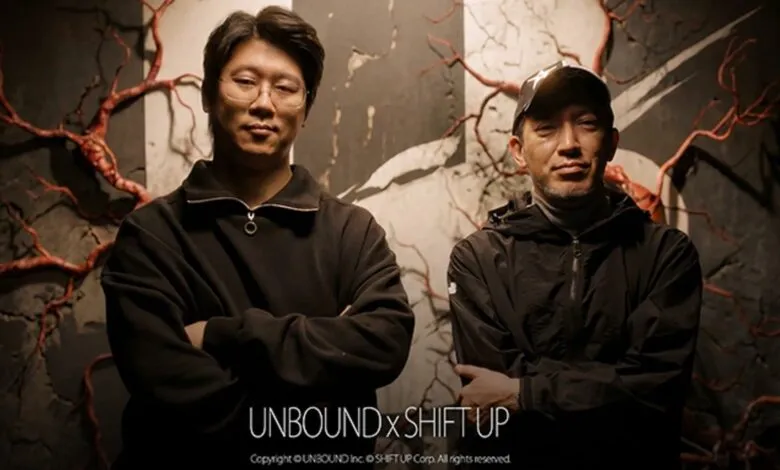 Two men stand in front of a textured backdrop with branching red patterns.