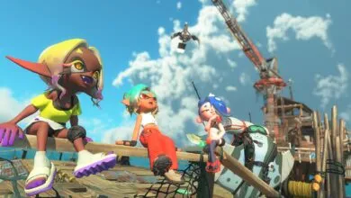 Three Splatoon characters sit on a wooden structure with a construction crane in the background.
