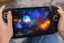 Hands holding a Lenovo Legion Go playing a colorful action RPG.