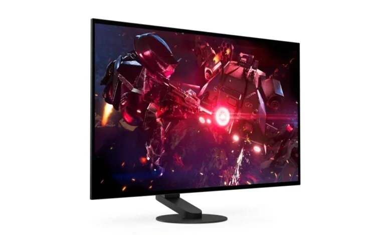 Gaming monitor displaying intense sci-fi battle scene with robots.