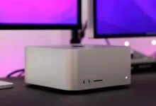 Close-up of a Mac Studio desktop computer with dual displays.