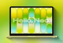 Citrus-colored laptop displays 'Hello, Neo.' against a vibrant, gradient background.