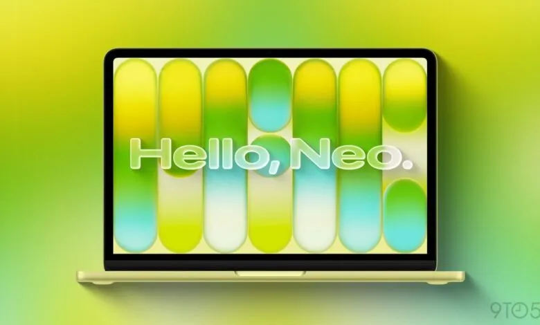 Citrus-colored laptop displays 'Hello, Neo.' against a vibrant, gradient background.