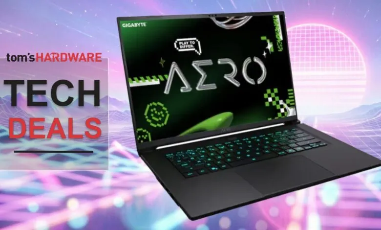 Gigabyte Aero laptop on display with a retro 80s-style background.